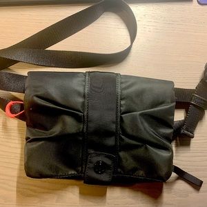 New no tags. Lululemon small Crossbody bag. 4 pockets. Clear phone pocket.